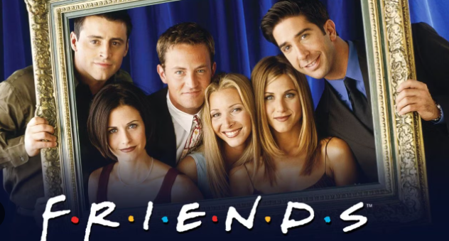 Friends cast posing with frame