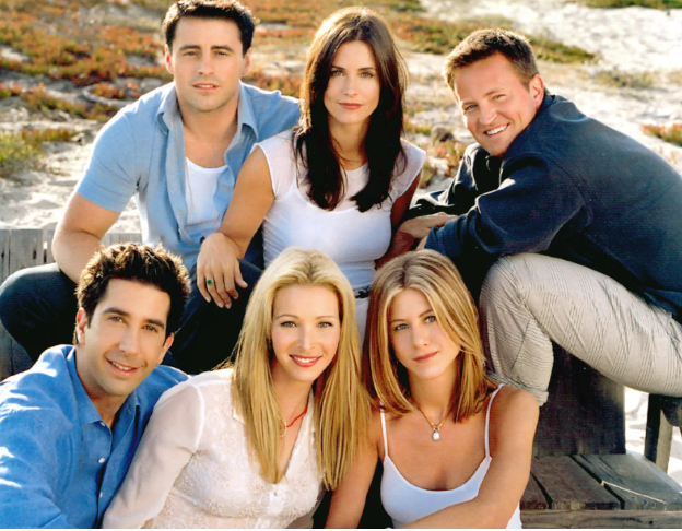 Friends cast posing at beach