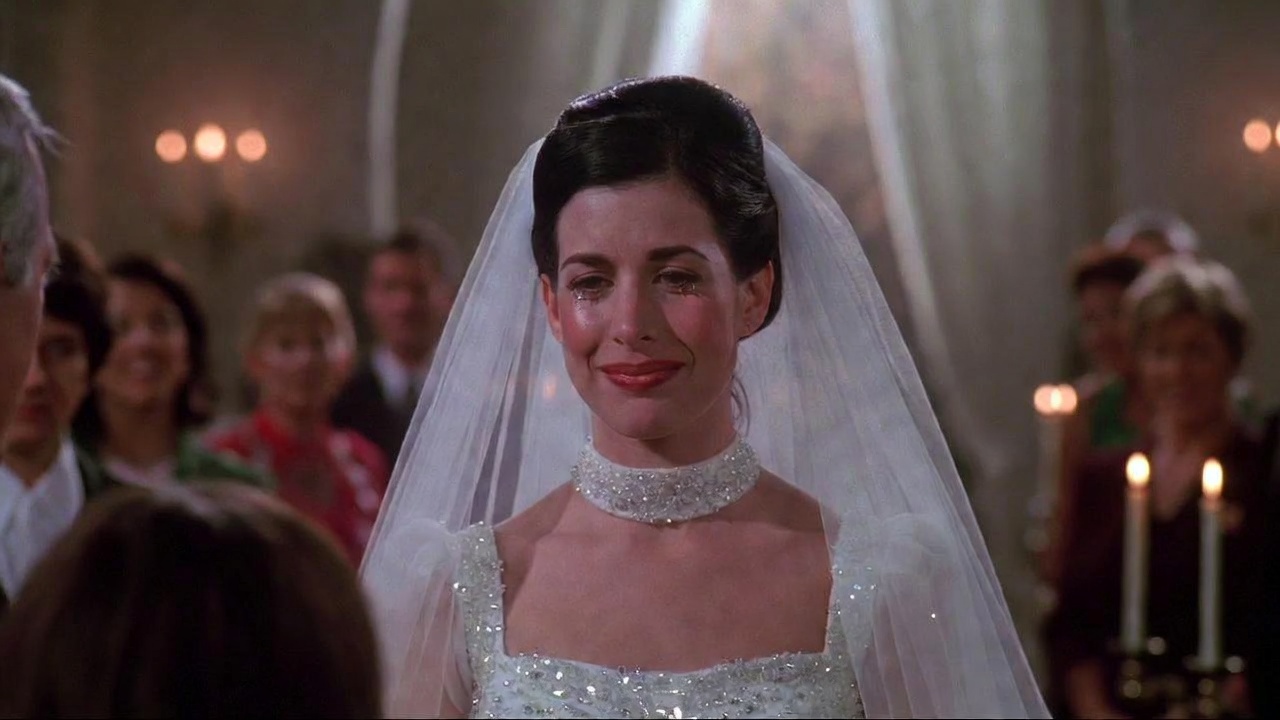 Monica Geller in wedding dress during emotional aisle or vow moment in Friends Monica and Chandler wedding episodes